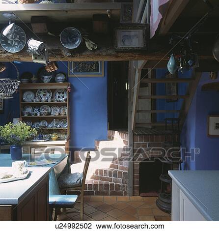 Brick staircase in blue cottage dining room View Large Photo Image Stock Image - Brick staircase in blue cottage dining room. Fotosearch