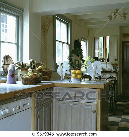 Built-in dishwasher in traditional kitchen with distressed grey wooden cupboard doors View Large Photo Image Stock Photography - Built-in dishwasher in traditional kitchen with distressed grey wooden cupboard doors. Fotosearch