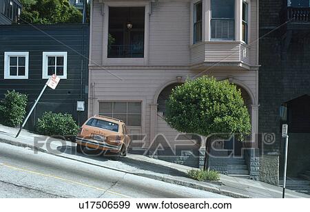 Car and small tree on sloping sidewalk in front of house in San Francisco View Large Photo Image Stock Photo - Car and small tree on sloping sidewalk in front of house in San Francisco . Fotosearch