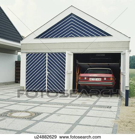 Car in garage of modern house View Large Photo Image Stock Photo - Car in garage of modern house. Fotosearch