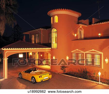 Car on drive in front of large villa lit at night in Southern Spain View Large Photo Image Stock Image - Car on drive in front of large villa lit at night in Southern Spain. Fotosearch