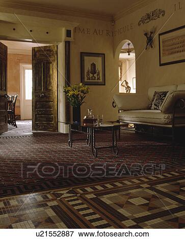 Stock Photo - Carpet and tessallated floor tiles in traditional living room. Fotosearch