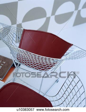 Stock Photo - Charles Eames wirework chairs. Fotosearch