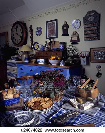 Cheese and biscuits on blue+white checked cloth in traditional kitchen View Large Photo Image Stock Image - Cheese and biscuits on blue+white checked cloth in traditional kitchen . Fotosearch