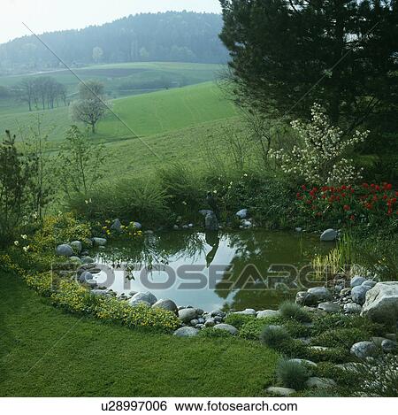 Circular pond in country garden View Large Photo Image Stock Photograph - Circular pond in country garden. Fotosearch