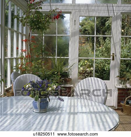Circular table and lloyd loom chairs in square conservatory. View Large Photo Image Stock Image - Circular table and lloyd loom chairs in square conservatory.. Fotosearch