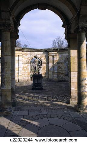 Picture - Classical statue in country garden courtyard. Fotosearch