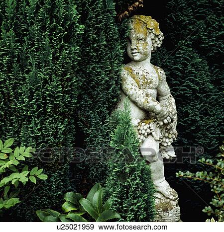 Stock Photo - Classical statue in country garden. Fotosearch