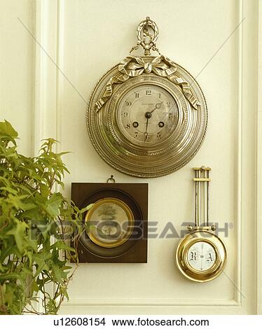 Picture - Close-up of antique clock and barometer. Fotosearch