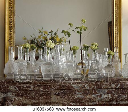 Close-up of antique pressed-glass decanters on mantelpiece View Large Photo Image Stock Photo - Close-up of antique pressed-glass decanters on mantelpiece. Fotosearch