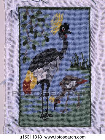 Close-up of bird motif cross-stitch View Large Photo Image Stock Photo - Close-up of bird motif cross-stitch. Fotosearch