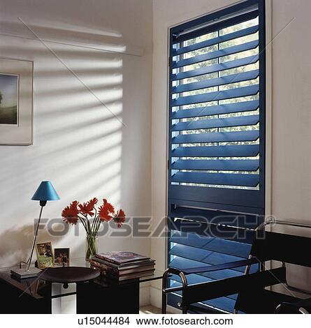 Picture - Close-up of blue slatted blind on modern window . Fotosearch
