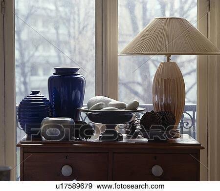 Stock Photo - Close-up of blue vases and cream lamp. Fotosearch