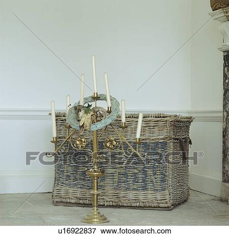 Close-up of brass candlestick and old wicker chest View Large Photo Image Stock Photo - Close-up of brass candlestick and old wicker chest. Fotosearch