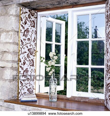 Close-up of casement cottage window with floral shutters View Large Photo Image Picture - Close-up of casement cottage window with floral shutters. Fotosearch