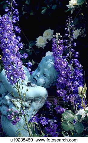 Stock Image - Close-up of classical statues in the garden. Fotosearch