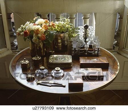 Stock Photo - Close-up of collection of antique wood boxes and inkwells on antique table. Fotosearch