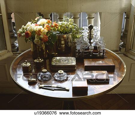 Stock Photograph - Close-up of collection of antique wood boxes and inkwells on antique table. Fotosearch