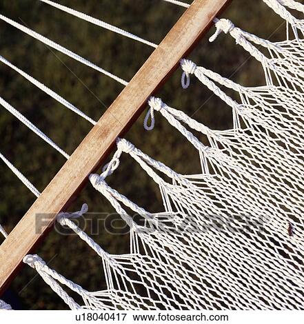 Close-up of cream crochet hammock and wooden support View Large Photo Image Stock Photo - Close-up of cream crochet hammock and wooden support. Fotosearch