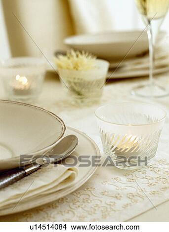Close Up Of Cream Plates And Candle In Glass Holder On Dining Table Picture U14514084 Fotosearch - Dining Table Plate Holder Close Up Of Cream Plates And Candle In Glass Holder On Dining Table Picture U14514084 Fotosearch - Dining Table Plate Holder