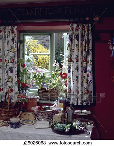 Stock Photo - Close-up of floral curtains at kitchen window. Fotosearch