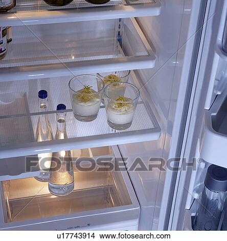 Close-up of fridge with open door and food inside View Large Photo Image Picture - Close-up of fridge with open door and food inside . Fotosearch
