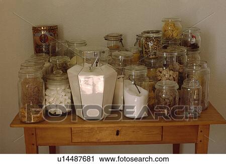 Close-up of glass storage jars on wooden table View Large Photo Image Stock Image - Close-up of glass storage jars on wooden table. Fotosearch