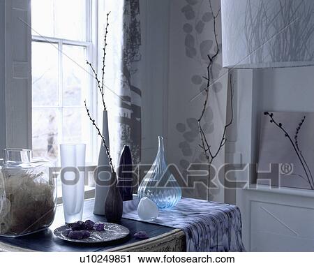 Close-up of glass vases on table View Large Photo Image Stock Image - Close-up of glass vases on table. Fotosearch