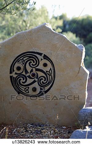 Stock Image - Close up of inscription on large stone. Fotosearch