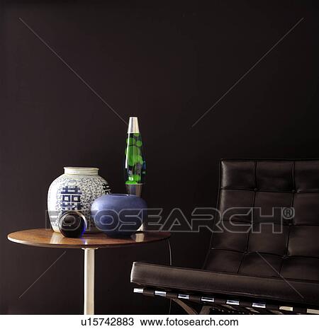 Close-up of lava lamp and vases on table View Large Photo Image Stock Image - Close-up of lava lamp and vases on table. Fotosearch