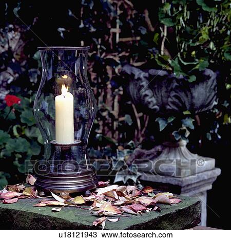 Stock Image - Close-up of lighted candle in glass storm lantern&#13; &#10; &#13; &#10; &#13; &#10; &#13; &#10; &#13; &#10; &#13; &#10;. Fotosearch