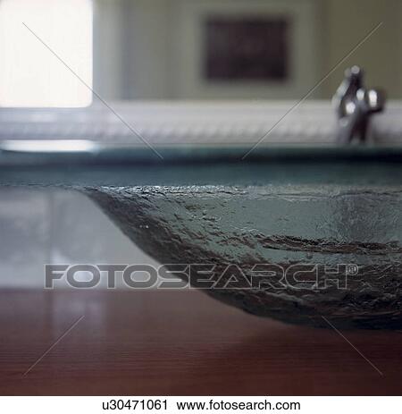 Stock Image - Close-up of modern glass basin. Fotosearch