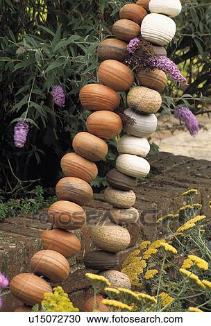 Stock Image - Close-up of modern sculpture in the garden. Fotosearch