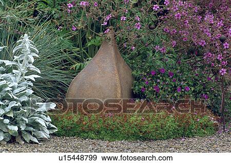 Stock Photo - Close-up of modern sculpture in the garden. Fotosearch