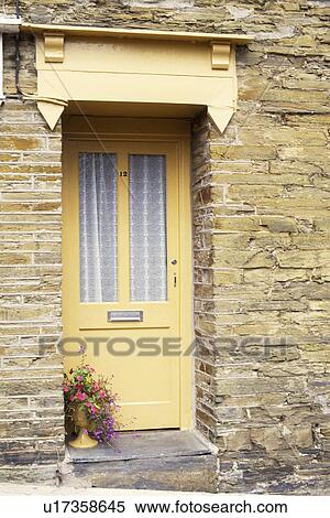 Stock Photography - Close up of neutral half glazed front door. Fotosearch