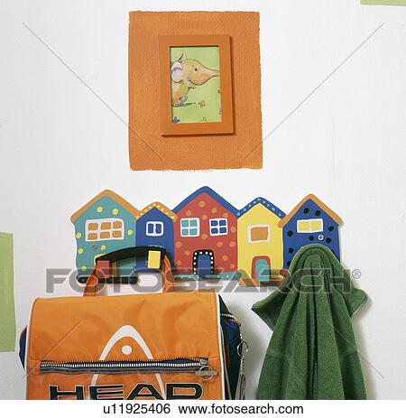 close-up of novelty house-shaped storage pegs with child's bag and coat View Large Photo Image Stock Photograph - close-up of novelty house-shaped storage pegs with child's bag and coat. Fotosearch