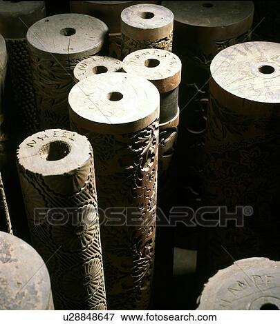 Stock Photo - Close-up of old woodblock wallpaper rolls. Fotosearch