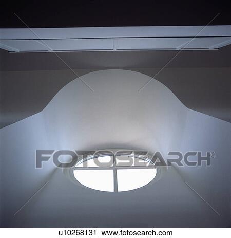 Stock Image - Close-up of oval attic window. Fotosearch