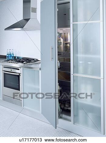 Close-up of oven and large fridge-freezer with opaque glass doors View Large Photo Image Stock Image - Close-up of oven and large fridge-freezer with opaque glass doors . Fotosearch