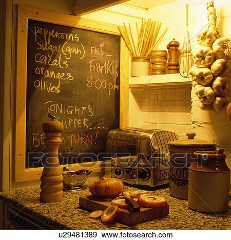 Close-up of peppermill and chrome toaster below chalkboard View Large Photo Image Stock Photo - Close-up of peppermill and chrome toaster below chalkboard . Fotosearch