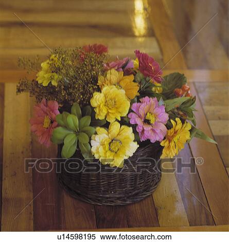 Stock Photography - Close-up of pink and yellow silk zinnias in floral arrangement. Fotosearch
