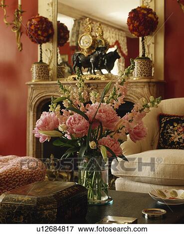 Close-up of pink paeonies in glass vase in living room View Large Photo Image Stock Photo - Close-up of pink paeonies in glass vase in living room. Fotosearch