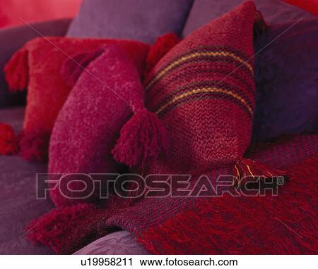 Close-up of red chenille cushions on purple sofa View Large Photo Image Stock Image - Close-up of red chenille cushions on purple sofa. Fotosearch