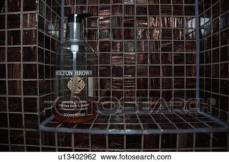 Close up of shower gel on brown mosaic tiled alcove shelf View Large Photo Image Stock Image - Close up of shower gel on brown mosaic tiled alcove shelf. Fotosearch