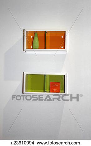 Close-up of small box shelves with green and orange glass doors View Large Photo Image Picture - Close-up of small box shelves with green and orange glass doors. Fotosearch