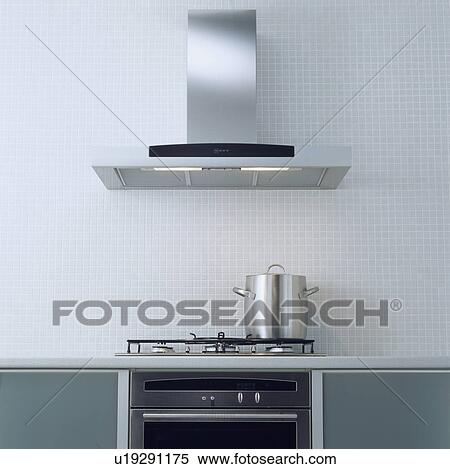 Close-up of stainless steel extractor above tall steel pan on hob View Large Photo Image Stock Photography - Close-up of stainless steel extractor above tall steel pan on hob . Fotosearch