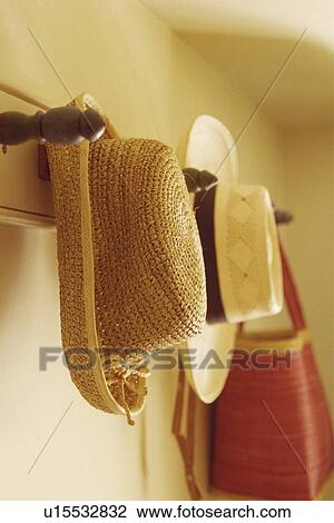 Close-up of straw hats on pegrail View Large Photo Image Stock Image - Close-up of straw hats on pegrail. Fotosearch
