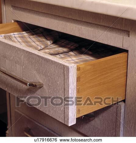 Close up of table napkins in open drawer View Large Photo Image Stock Photograph - Close up of table napkins in open drawer. Fotosearch