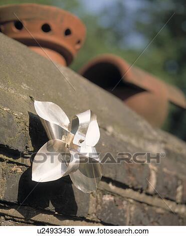 Close-up of toy windmill on wall View Large Photo Image Stock Photograph - Close-up of toy windmill on wall. Fotosearch