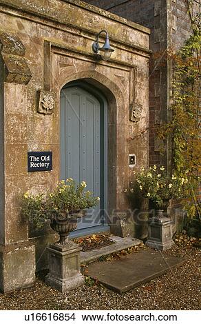 Close-up of traditional grey front door in stone wall View Large Photo Image Picture - Close-up of traditional grey front door in stone wall. Fotosearch